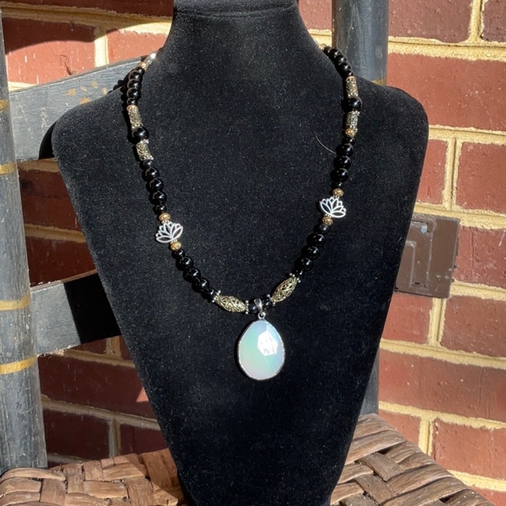 Handmade natural stone necklace withe quartz pendant.